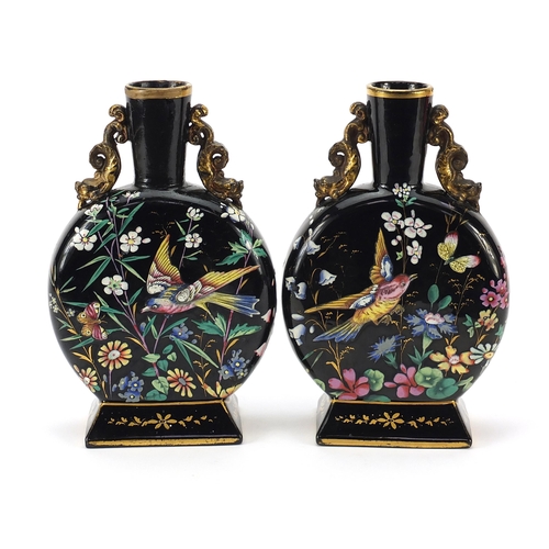 74 - Attributed to Moser, pair of Bohemian glass moon flasks enamelled with birds amongst flowers, each 2... 