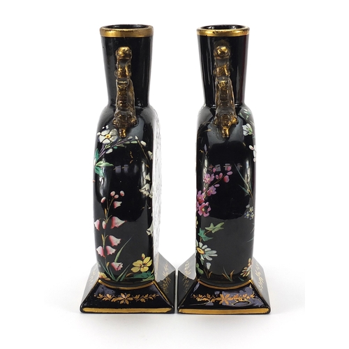 74 - Attributed to Moser, pair of Bohemian glass moon flasks enamelled with birds amongst flowers, each 2... 