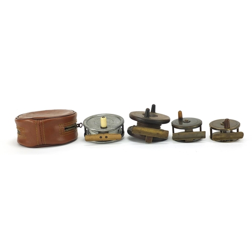 667 - Four Victorian and later freshwater fishing reels including two miniature brass examples, the larges... 