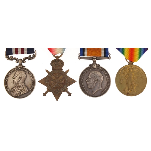 2058 - British military World War I four medal group with related ephemera including a Mons Star and George... 