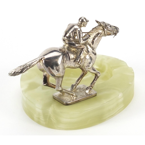 95 - Art Deco onyx ashtray mounted with a silvered horse and jockey, 14.5cm in length