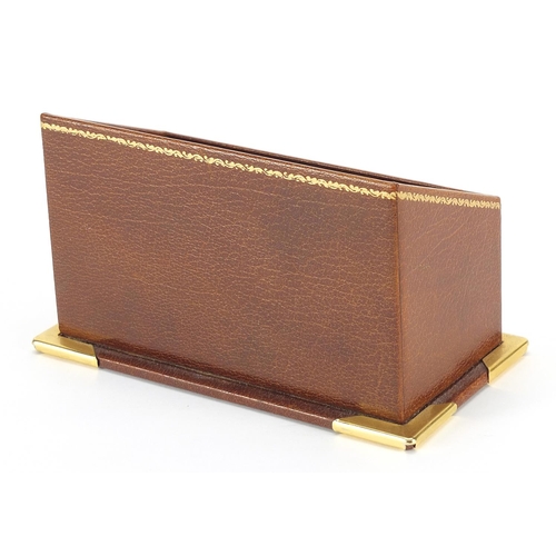 407 - Asprey tooled tan leather letter rack with brass mounts, 9cm H x 15.5cm W x 8.5cm D