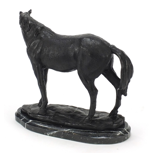 646 - Patinated bronze study of a horse raised on a black marble base, 23cm high