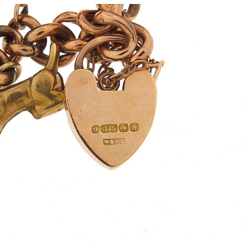 2252 - 9ct rose gold charm bracelet with a selection of mostly 9ct gold charms including rotating globe, di... 