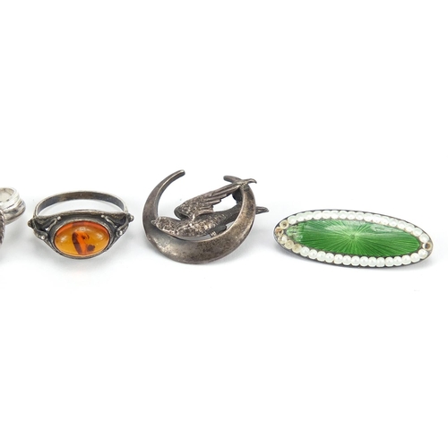 2767 - Antique and later silver jewellery including a guilloche enamel brooch, amber rings and buckle rings... 