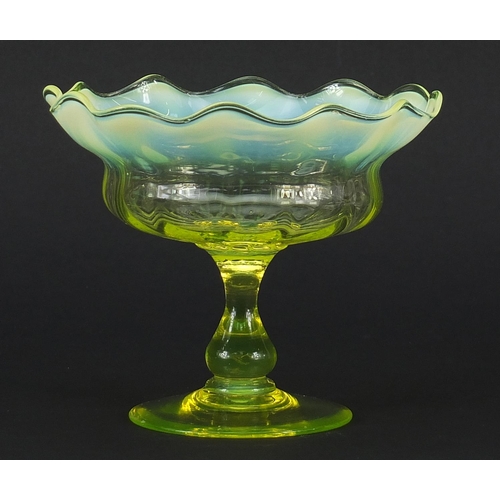 106 - Art Nouveau Vaseline glass pedestal bowl with frilled rim, 12.5cm high x 15cm in diameter