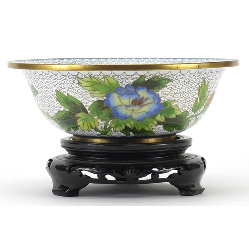 440 - Chinese cloisonne bowl enamelled with butterflies amongst birds, the bowl raised on a carved hardwoo... 