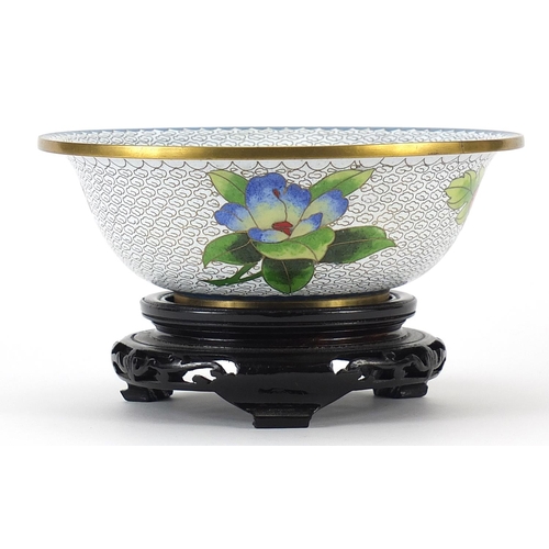 440 - Chinese cloisonne bowl enamelled with butterflies amongst birds, the bowl raised on a carved hardwoo... 