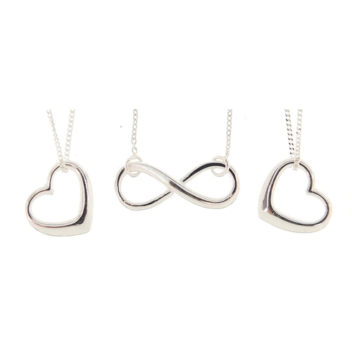 2789 - Three silver heart and bow design pendants on necklaces