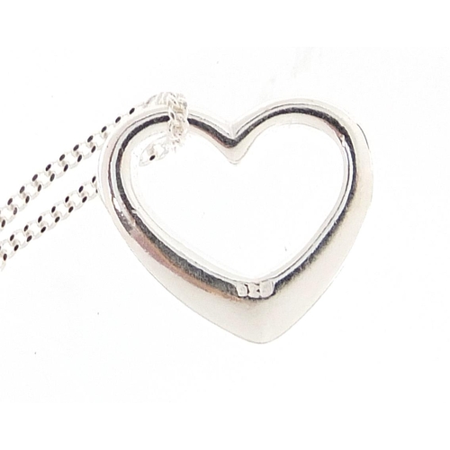 2789 - Three silver heart and bow design pendants on necklaces