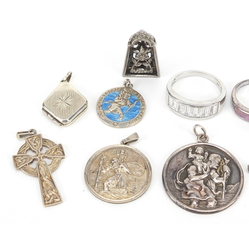 2787 - Silver jewellery including St Christopher pendants, Celtic cross pendant and rings, the largest 6.5c... 