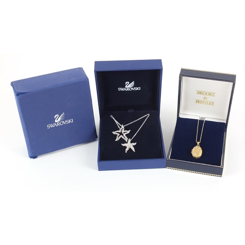 2794 - 9ct gold locket on a 9ct gold necklace 1.8g and a Swarovski Crystal starfish necklace