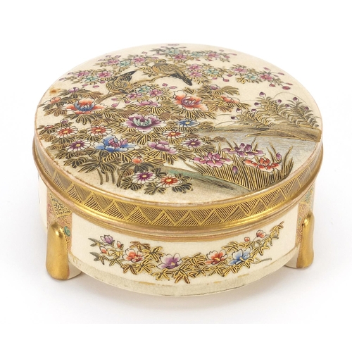 261 - Japanese Satsuma pottery box and cover hand painted with birds and flowers in a landscape, 10.5cm in... 