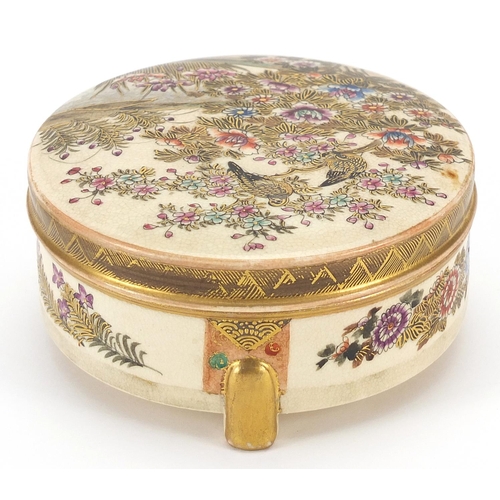 261 - Japanese Satsuma pottery box and cover hand painted with birds and flowers in a landscape, 10.5cm in... 