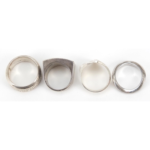 2803 - Four designer silver rings including Emporio Armani, various sizes, 53.8g