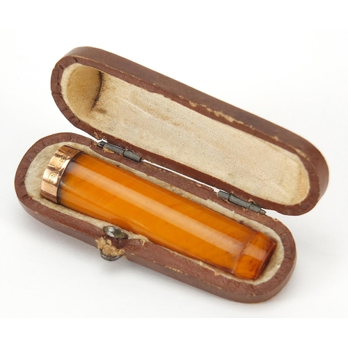 650 - 9ct gold mounted butterscotch amber cheroot holder with case, 5.2cm in length