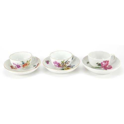 70 - Meissen, three German porcelain cups with saucers hand painted with flowers, two with William Woodfi... 