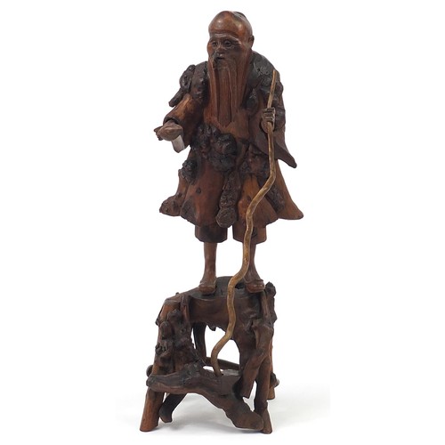 324 - Chinese root wood carving of an elder holding a staff, 51cm high