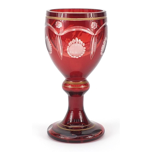 153 - Bohemian ruby overlaid glass goblet etched with two geese, 19.5cm high