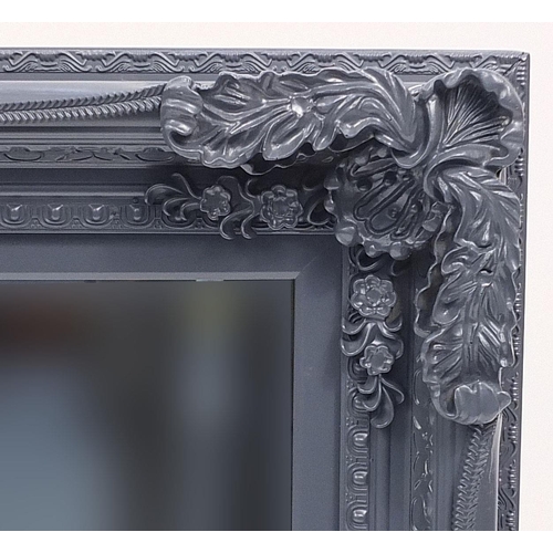 695 - Large ornate framed wall hanging mirror with bevelled glass, 120cm x 86cm