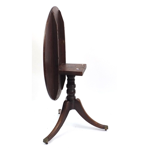 690 - Victorian walnut and mahogany tilt top table with tripod base and brass casters, 73cm H x 95cm W x 7... 