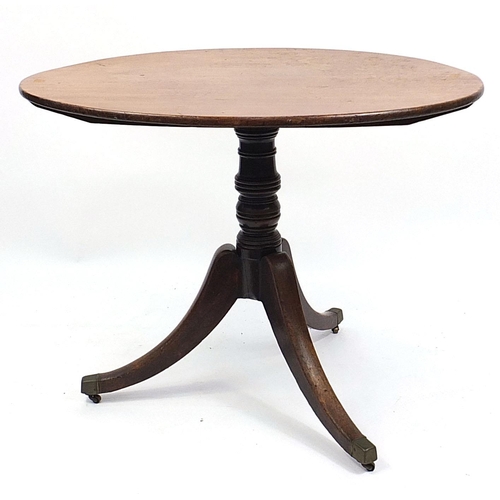 690 - Victorian walnut and mahogany tilt top table with tripod base and brass casters, 73cm H x 95cm W x 7... 