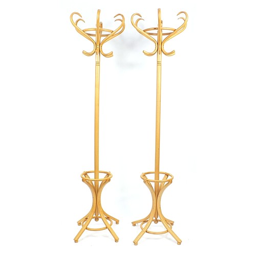 700 - Pair of light bentwood hat and coat stands, 194cm high