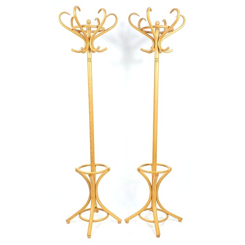 700 - Pair of light bentwood hat and coat stands, 194cm high