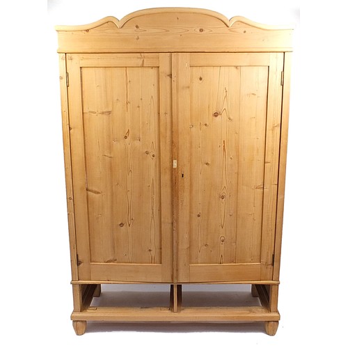 696 - **WITHDRAWN**European stripped pine wardrobe, 200cm H X 132cm W x 61cm D