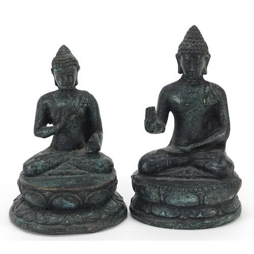 640 - Two Nepalese patinated metal figures of Buddha, the largest 14cm high