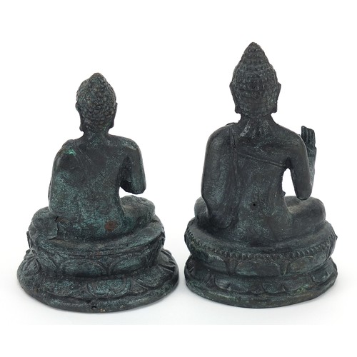 640 - Two Nepalese patinated metal figures of Buddha, the largest 14cm high