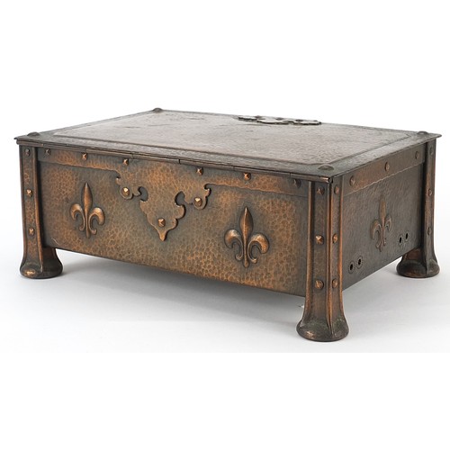 16 - James Smithies of Wilmslow, Arts & Crafts copper casket with fleur de Lys, 10.5cm H x 26cm W x 17cm ... 
