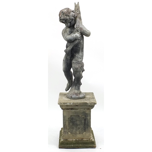 688a - Lead garden water feature of Putti holding a fish, raised on a square concrete base, 145cm high