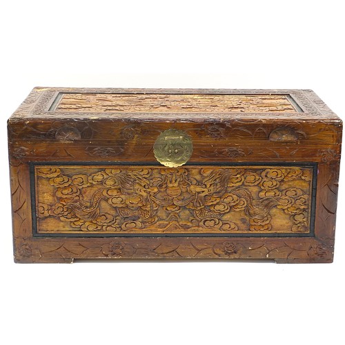 702A - Chinese camphor wood trunk carved with dragons amongst clouds, 46cm H x 101cm W x 53cm D