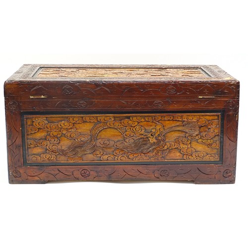 702A - Chinese camphor wood trunk carved with dragons amongst clouds, 46cm H x 101cm W x 53cm D