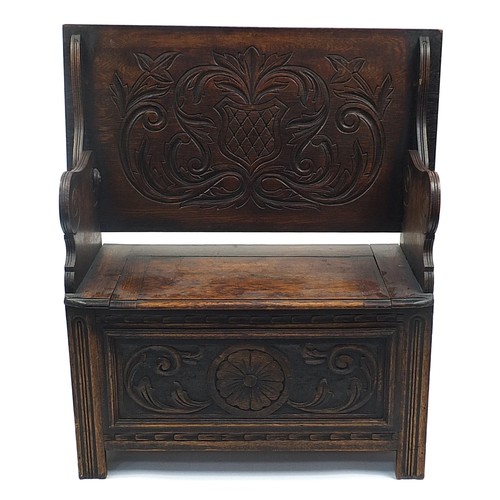 703a - Carved oak monk's bench with lift up top and hinged seat, 73cm H x 92cm W x 50cm D