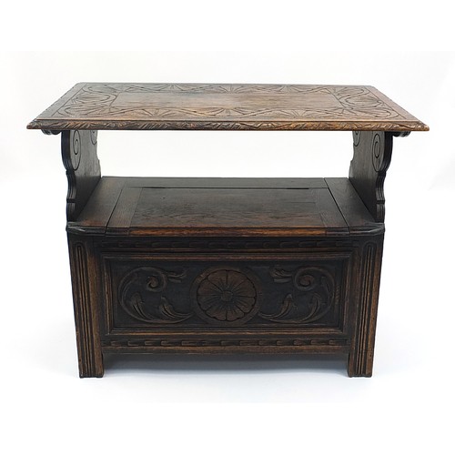 703a - Carved oak monk's bench with lift up top and hinged seat, 73cm H x 92cm W x 50cm D