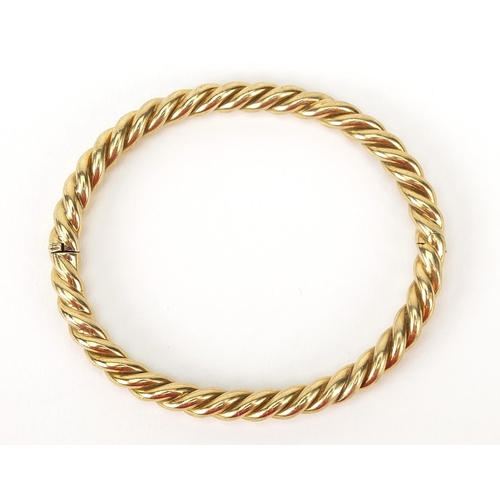 11 - 9ct gold rope twist hinged bangle, 7cm wide, 21.6g - this lot is sold without buyer’s premium, the h... 