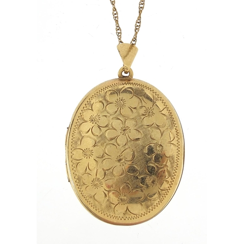 3 - Oval 9ct gold locket engraved with flowers on a 9ct gold rope twist necklace, 3.4cm high and 62cm in... 