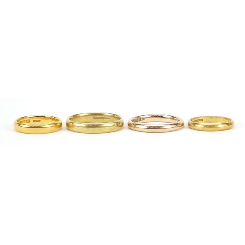 30 - Four gold rings comprising one 22ct gold, size K, 4.0g, two 18ct gold, sizes J and Q, 7.6g and one 1... 