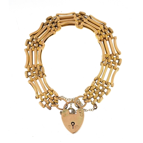 31 - 9ct gold four row gate link bracelet with love heart padlock, 16cm in length, 17.6g - this lot is so... 