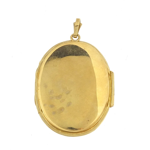 47 - Large 9ct gold oval locket engraved with flowers, 4.2cm high, 12.2g - this lot is sold without buyer... 