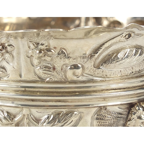 68 - George Nathan & Ridley Hayes, Victorian silver bowl embossed with hogs and swans, raised on three li... 