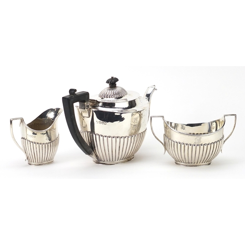 19 - C S Harris & Sons Ltd, Edwardian matched silver three piece demi fluted tea service retailed by Finn... 