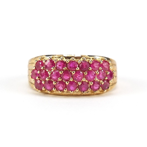 165 - 9ct gold ruby three row cluster ring, size N/O, 3.7g