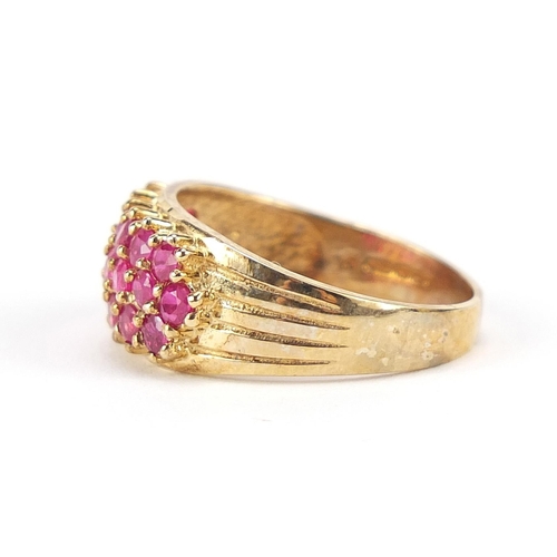 165 - 9ct gold ruby three row cluster ring, size N/O, 3.7g