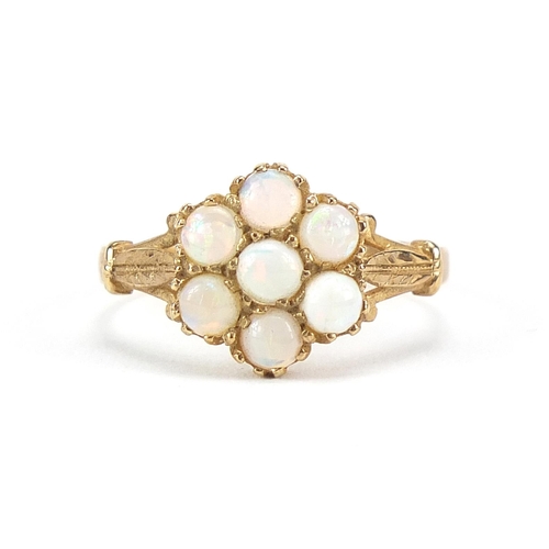 140 - 9ct gold opal cluster ring with engraved shoulders, size N/O, 2.2g