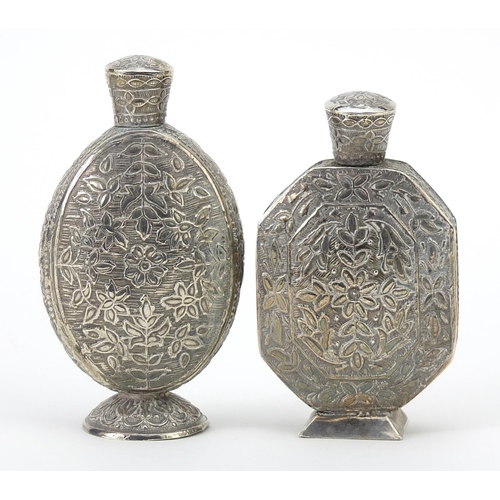 63 - Two Persian unmarked silver scent bottles engraved with flowers and foliage, the largest 8.1cm high,... 