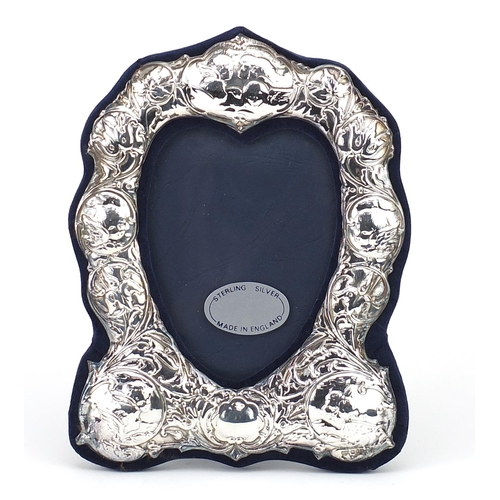 29 - Art Nouveau design silver easel photo frame embossed with Putti and stylised flowers, R.B.B, London ... 