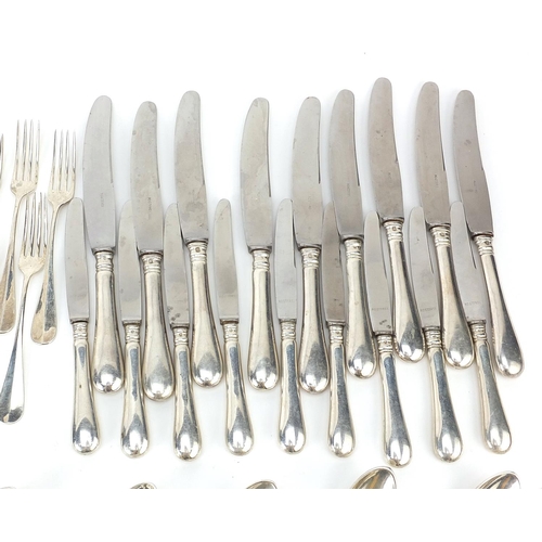 14A - German silver cutlery including tablespoons, knives with steel blades, forks and teaspoons, the larg... 